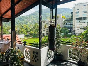 a balcony with a view of a city at The Shire in Kandy