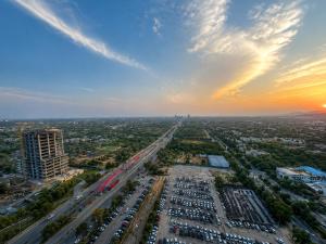 an aerial view of a city at sunset at Whispers above the city 2Bhk Centaurus Mall pool Gym City view in Islamabad