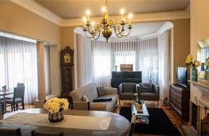 a living room with a couch and a table at Espinho Vintage - Alojamento de Charme in Espinho