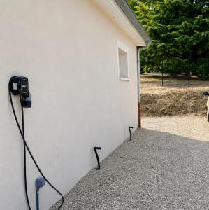 a building with a camera attached to the side of it at Beau Regard in Tournus +4 photos