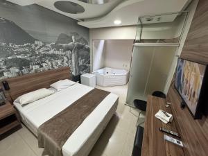 a bedroom with a bed and a painting on the wall at Add Hotéis Center Norte in São Paulo +46 photos