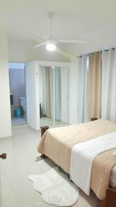 a hotel room with two beds and a mirror at condominio Crismairy in Bayahibe