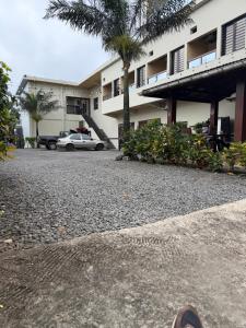 a car is parked in front of a building at Afrilodge Liberia in Monrovia