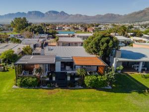 an aerial view of a house in a suburb at Sea Pine Cottage in Gordonʼs Bay