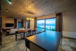 a living room with a couch and a dining room at Vila Marigold in Opatija