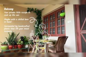 a sign for a table with chairs and plants at Gokarna Homestay in Kathmandu