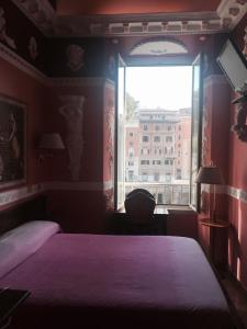 Postel nebo postele na pokoji v ubytování Hotel Barrett