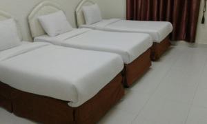 Postel nebo postele na pokoji v ubytování Jawharet Al Kheir Furnished Apartments
