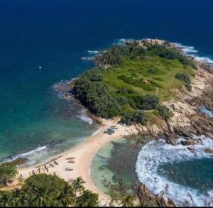 an aerial view of an island in the ocean at Nisho House Hiriketiya in Hiriketiya