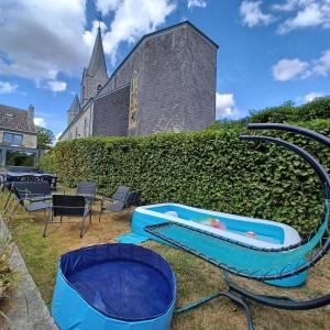 a large building with a large pool in the yard at A l'éc'Art in Wellin