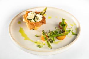 a white plate with some food on it at The Blue Bell Inn in Weaverthorpe
