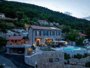an aerial view of a house with a swimming pool at Vila Marigold in Opatija
