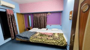 a bedroom with a bed in a room at new crown hotel in Indore