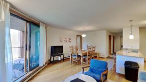 a living room with a kitchen and a dining room at 135 Marina Place in Dillon