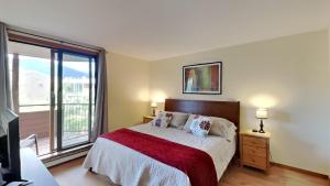 a bedroom with a bed and a large window at 135 Marina Place in Dillon +22 photos