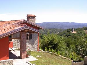 a stone house with a view of the mountains at Cà del Prino in Millesimo
