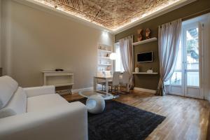 Televízia a/alebo spoločenská miestnosť v ubytovaní Apart Hotel Torino