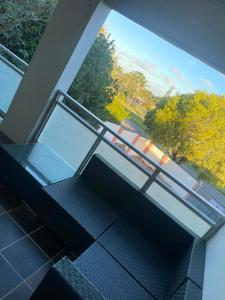 an empty balcony with a view of a street at Executive B & B in Beacon Bay
