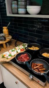 a counter with many different types of food on it at Boutique-Hotel "Stilvoll" in Andernach
