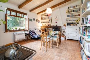 a kitchen and dining room with a table and chairs at Granducato di Monteballante in Pesaro