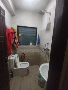a bathroom with a toilet and a sink at Gupta House in Katmandu International