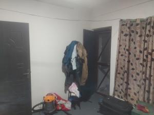 a room with a backpack hanging on the wall at Gupta House in Katmandu International