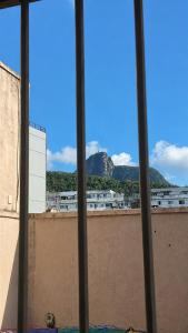 a view of a mountain from a window at Copacabana Rooms & Hostel in Rio de Janeiro