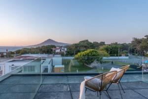 a couple of chairs sitting on top of a roof at Moledo Front Beach by Portugal Active in Viana do Castelo