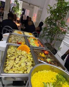 a buffet line with many different types of food at BelizeprivateChef in Dangriga