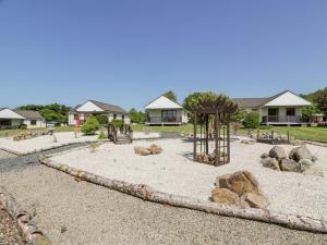 a park with a playground with rocks at 7 Brunston Avenue in Girvan