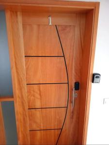 a wooden door with a wire attached to it at Beach 2 Min - Bright Central Studio - AC in Santa Maria