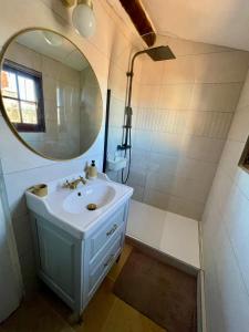 a bathroom with a sink and a mirror at Downtown apartment in Marseille
