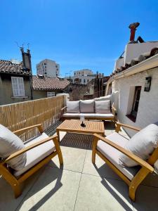 a patio with two chairs and a table on a balcony at Downtown apartment in Marseille
