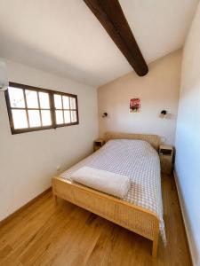 a bedroom with a bed and a window at Downtown apartment in Marseille