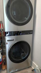 a microwave sitting on top of a washing machine at 1BR Apt 8 mins St Anthony, Unit B in Oklahoma City