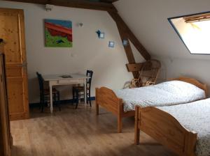 A bed or beds in a room at La Cense des 6 Sens