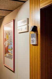 a sign on the wall of a room with a picture at H Boutique Peña Parda in La Herradura