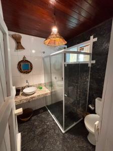 a bathroom with a glass shower and a sink at Blue Ocean Flats in Itacaré +59 photos