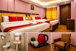 two beds in a hotel room with red and yellow walls at Hotel City Center in Bhairāhawā
