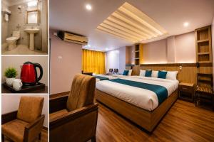 a hotel room with a bed and a bathroom at Hotel City Center in Bhairāhawā