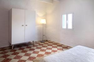 A bed or beds in a room at Cas Conco