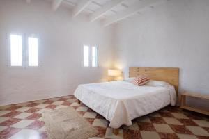 A bed or beds in a room at Cas Conco