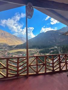 a view from the balcony of a house with mountains at Condor's Nest in Pisac