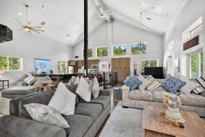 a living room with couches and a table at Manor at Brighton in Brighton