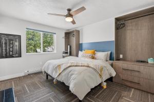 a bedroom with a bed and a ceiling fan at Manor at Brighton in Brighton