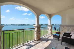 a balcony with a view of the water at Lakefront Paradise with Stunning Views! in Corsicana