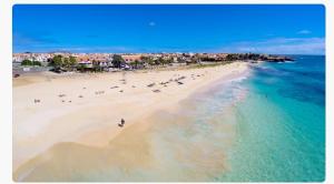 an overhead view of a beach with people in the water at Beach 2 Min - Bright Central Studio - AC in Santa Maria