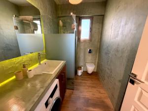 a bathroom with a sink and a toilet at Casa Marino in Chalkida +11 photos