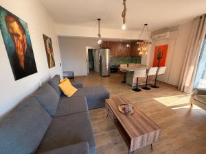 a living room with a couch and a table at Casa Marino in Chalkida