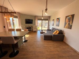 a living room with a couch and a table at Casa Marino in Chalkida